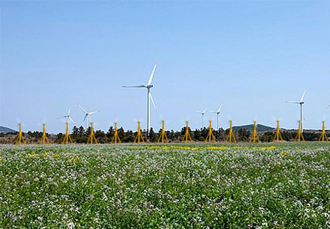 Pressebild: Artist rendition of the infill of a wind farm with 99 kW wind turbines lined up along an access road.