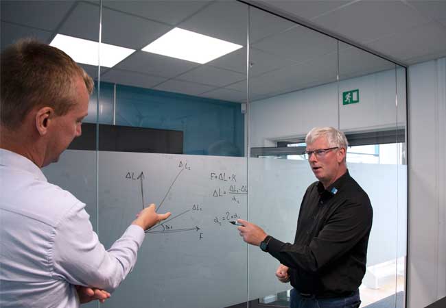 PB: Flemming Selmer Nielsen explaining his patented formula to a colleague