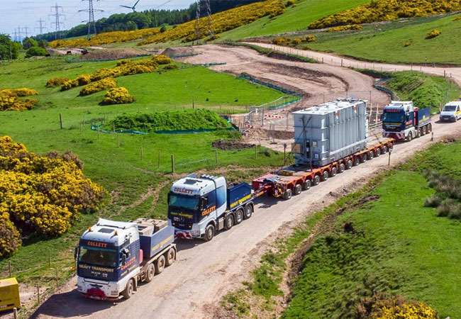 PB: Collett's 14-axle flat top modular trailer delivers the two shunt reactors.
