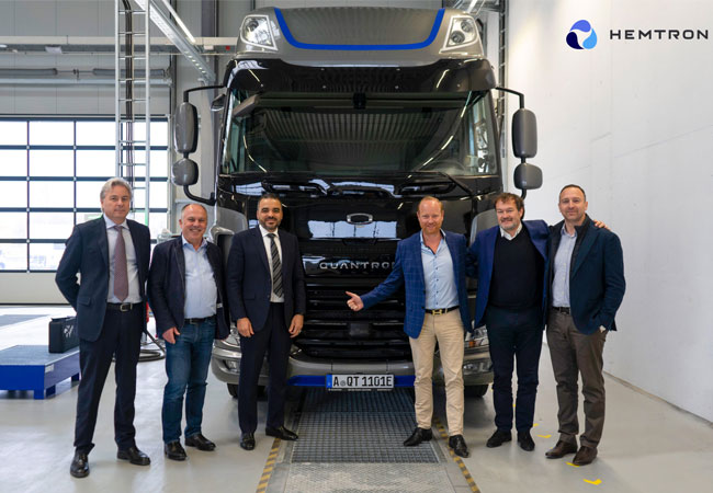 PB: V. l.: David Pezzulli, (Managing Director von Mesientos), Herbert Robel (CHRO & Co-Founder Quantron AG), Ahmed Elkerrami (CEO Oilinvest Group), Andreas Haller (Gründer & Vorstandsvorsitzender Quantron AG), Michael Perschke (CEO Quantron AG), Timothy Sullivan (Business Liaison Officer bei OBV)