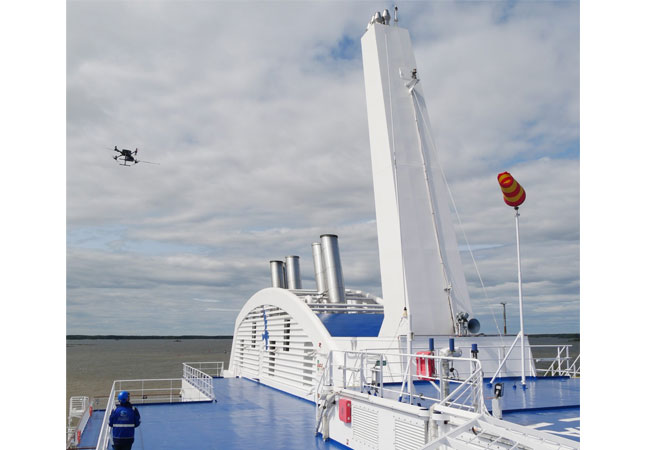 PB: Caption: Explicit ApS uses a drone to measure methane emissions in the exhaust plume of a ship while TNO measures in the exhaust stack from the engine room. / (Photo credit: Explicit ApS) High resolution copy of above for media use can be found here.