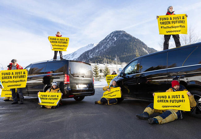 PB: Greenpeace Activists Block Heliport Lago ahead of WEF, Davos - Greenpeace activists from various countries blocked the arrivals of the participants of the World Economic Forum in Davos, Switzerland at the heliport Lago. The Greenpeace International peaceful protest aimed to hold polluting elites accountable and call on governments to tax the super-rich to fund climate, environmental and social action.