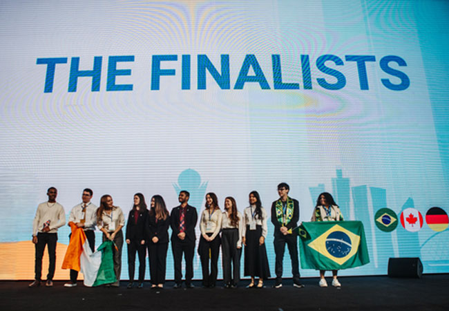PB: Finalists of the 2024 iTwin4Good Challenge on the competition stage in Kazakhstan. / ©: Bentley Systems und Enactus