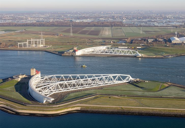 PB: The Maeslant Barrier, a massive storm surge barrier in the Netherlands which is managed and maintaned by Rijkswaterstaat. It protects Rotterdam and surrounding areas from North Sea flooding. Free use, please credit: Getty Images